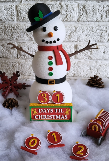 Snowman with '31 Days Til Christmas' display against a brick wall.