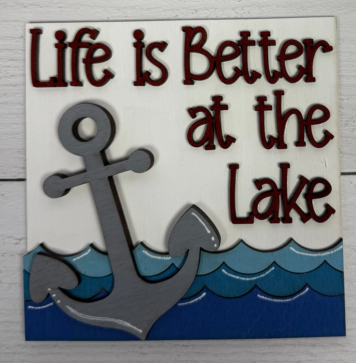 a sign with an anchor and waves