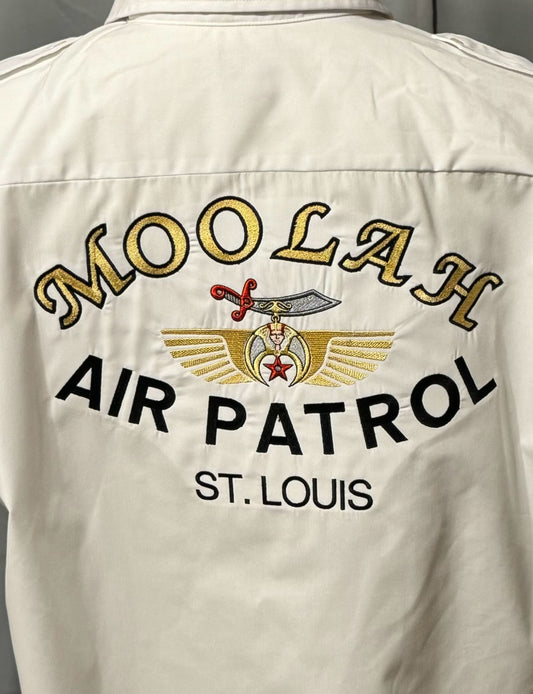 a white shirt with gold text on it