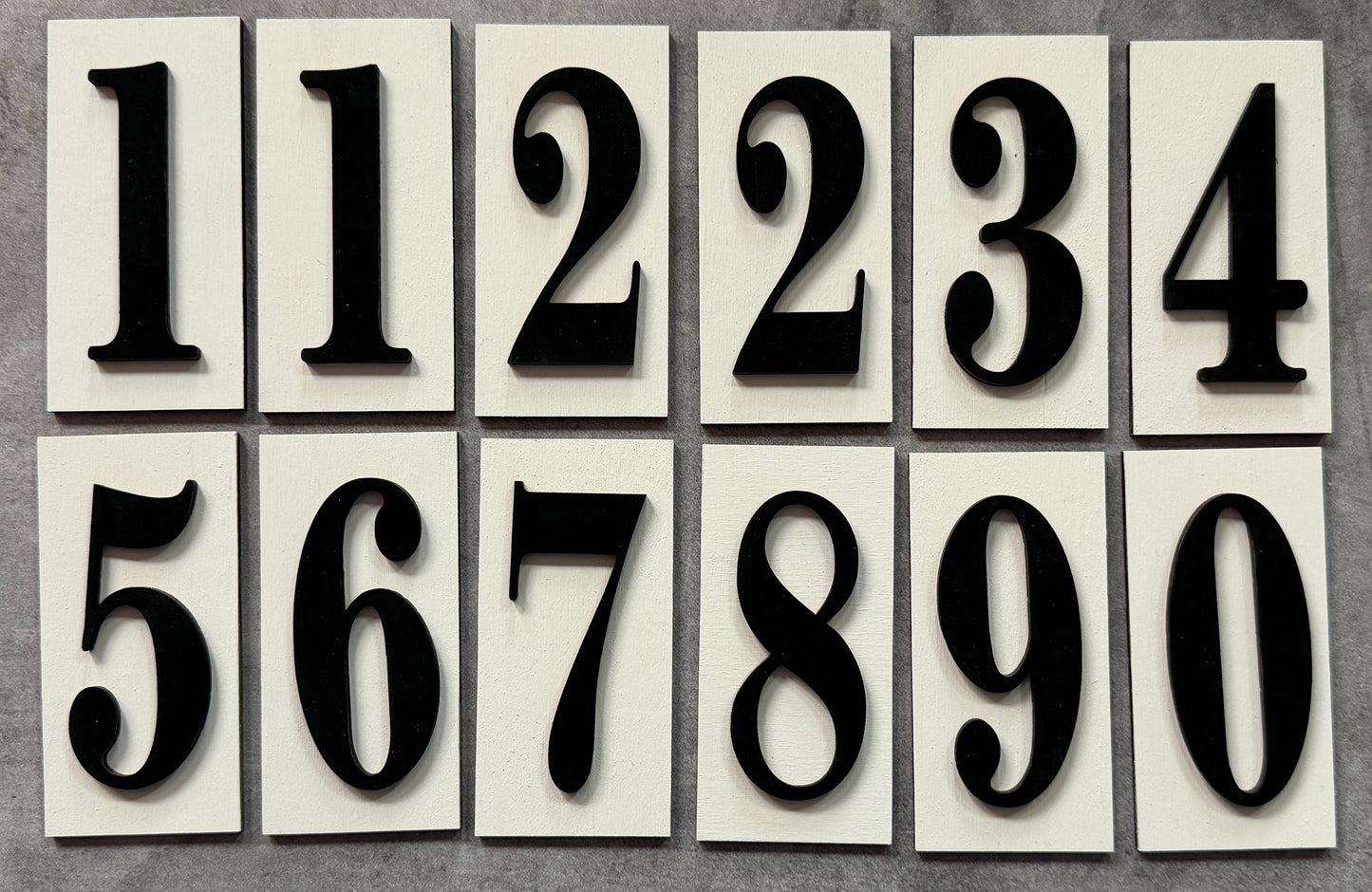 Set of black numbers on white tiles