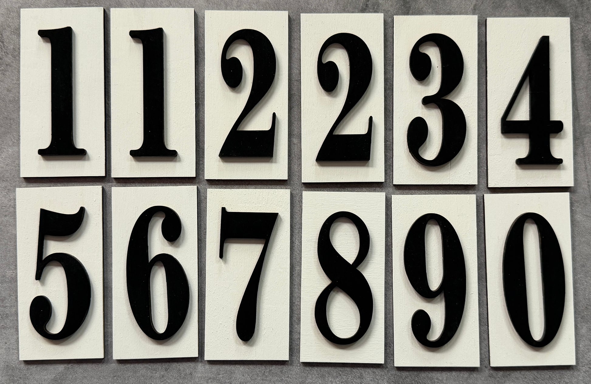 Set of black numbers on white tiles
