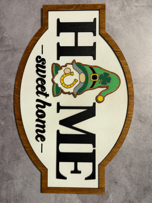 Decorative sign with 'Home Sweet Home' and leprechaun design on a gray background