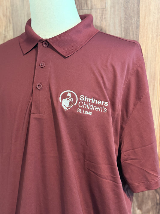 a red polo shirt with white text on it