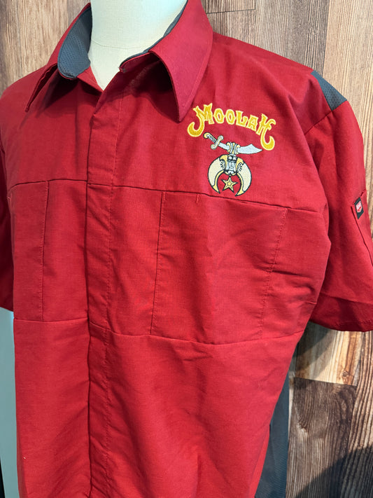 a red shirt with a logo on it
