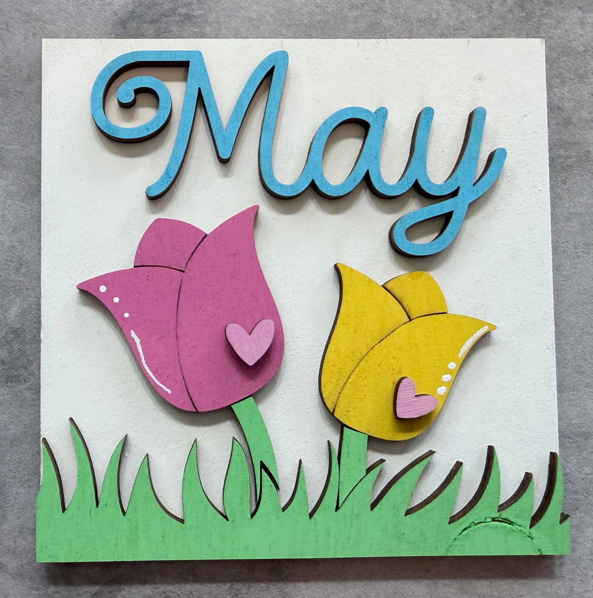 a sign with flowers and text