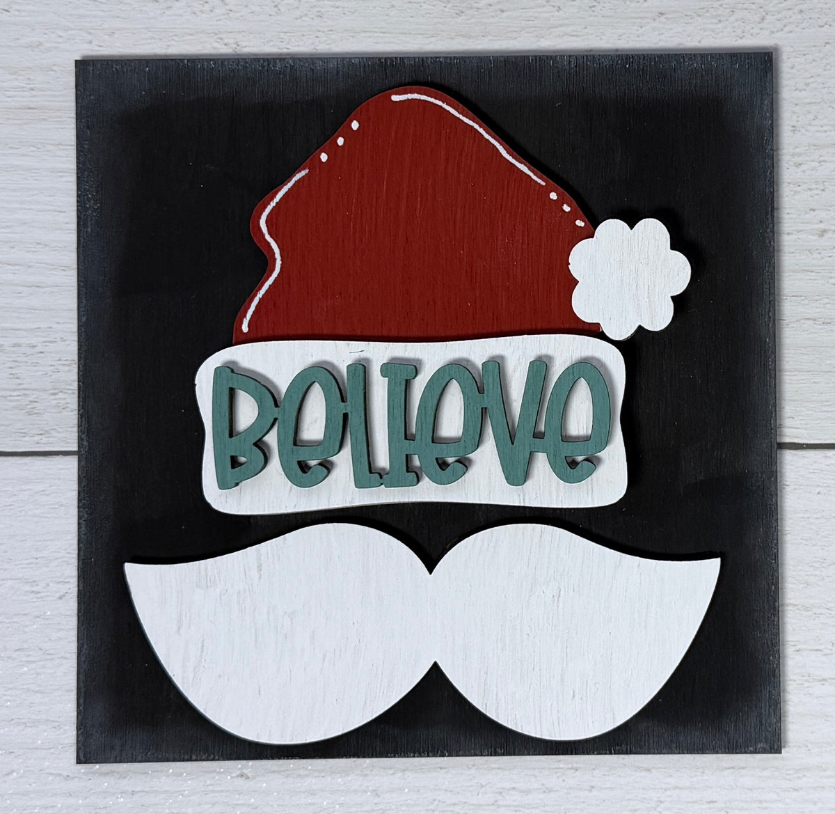 a sign with a mustache and a santa hat