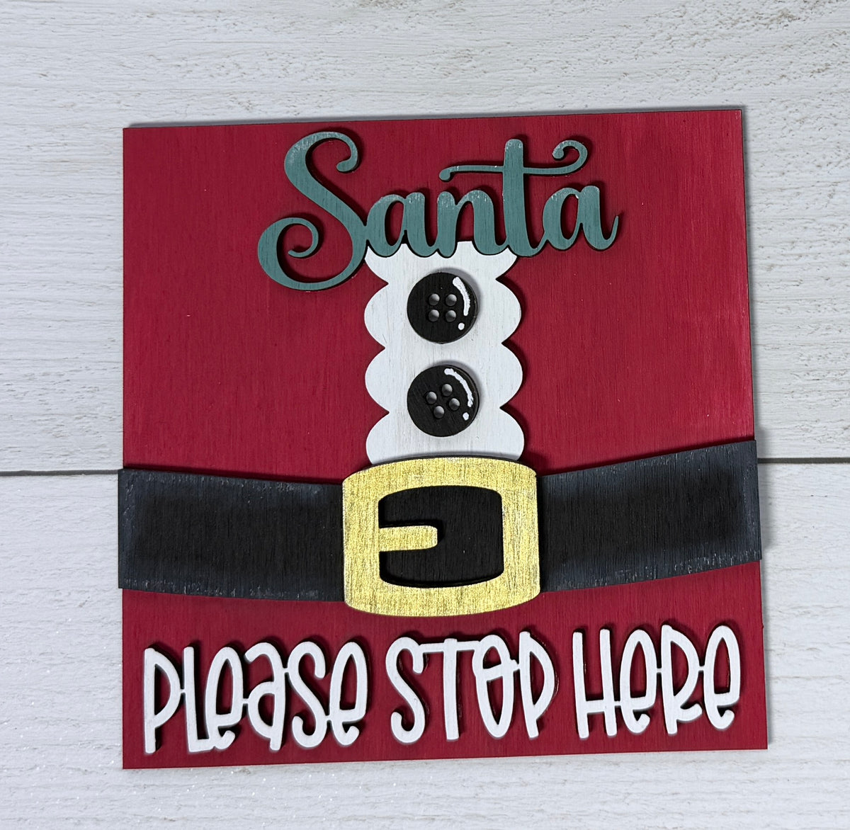 a sign with a belt and buttons on it