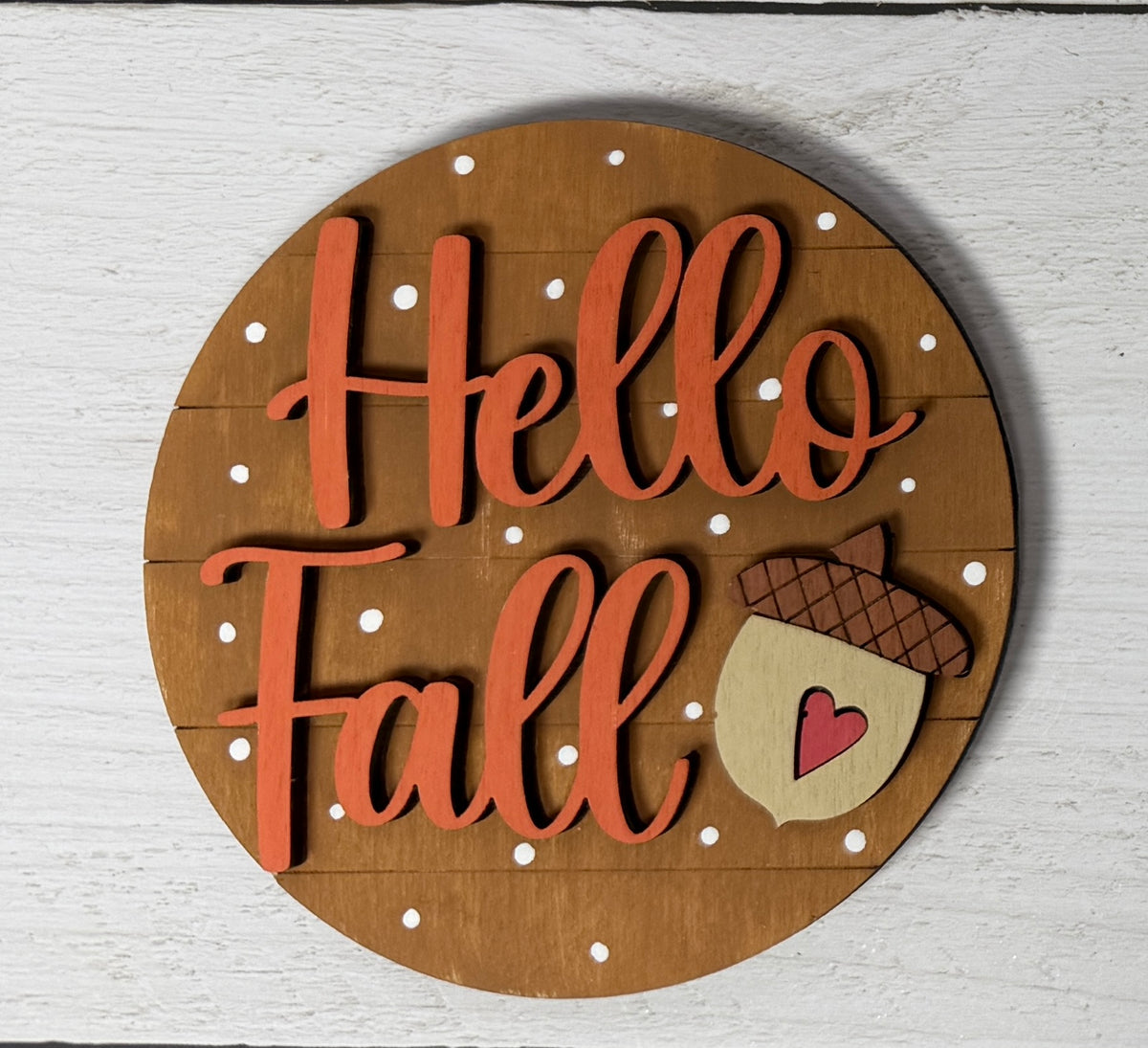 a sign on a wood surface
