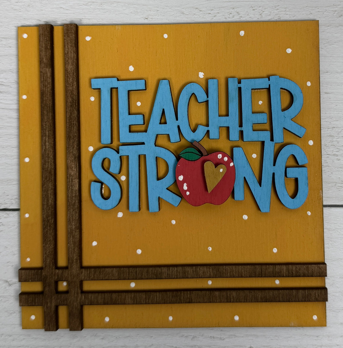 a yellow and blue sign with a red apple on it