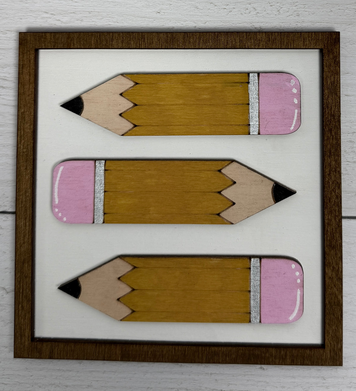 a group of pencils in a frame