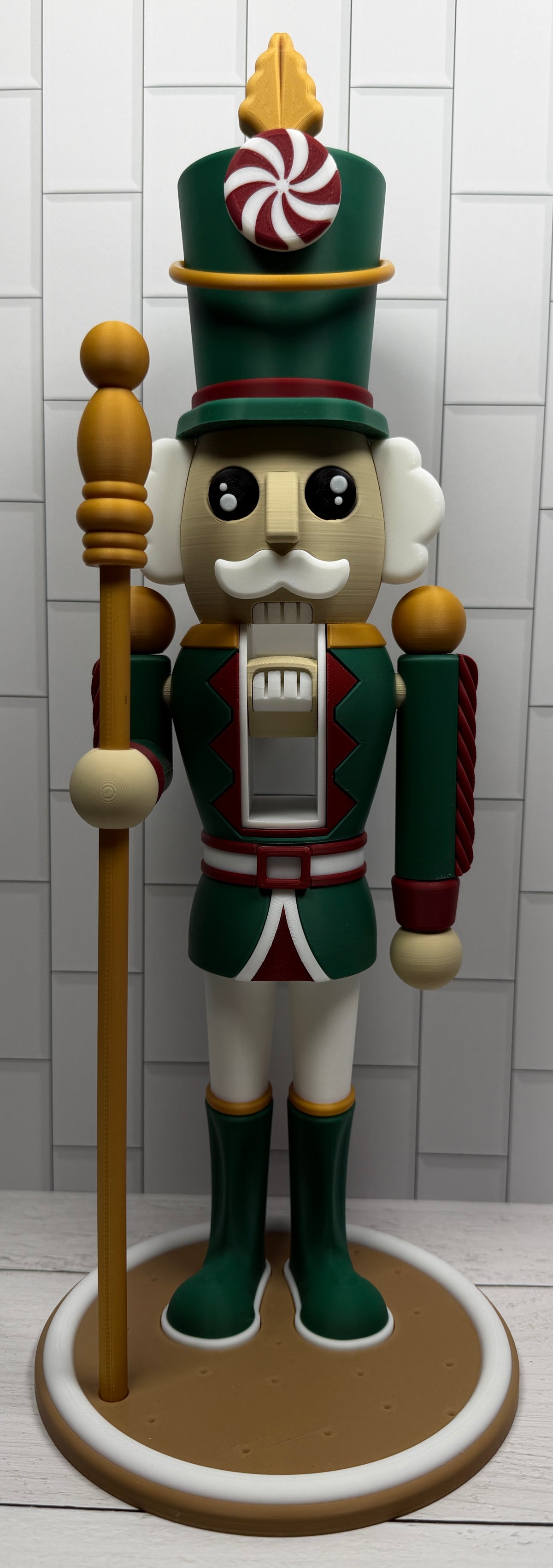 a wooden nutcracker with a staff