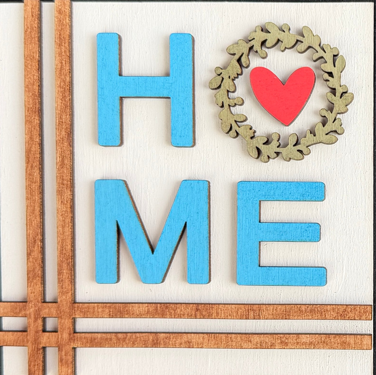 a sign with blue letters and a heart