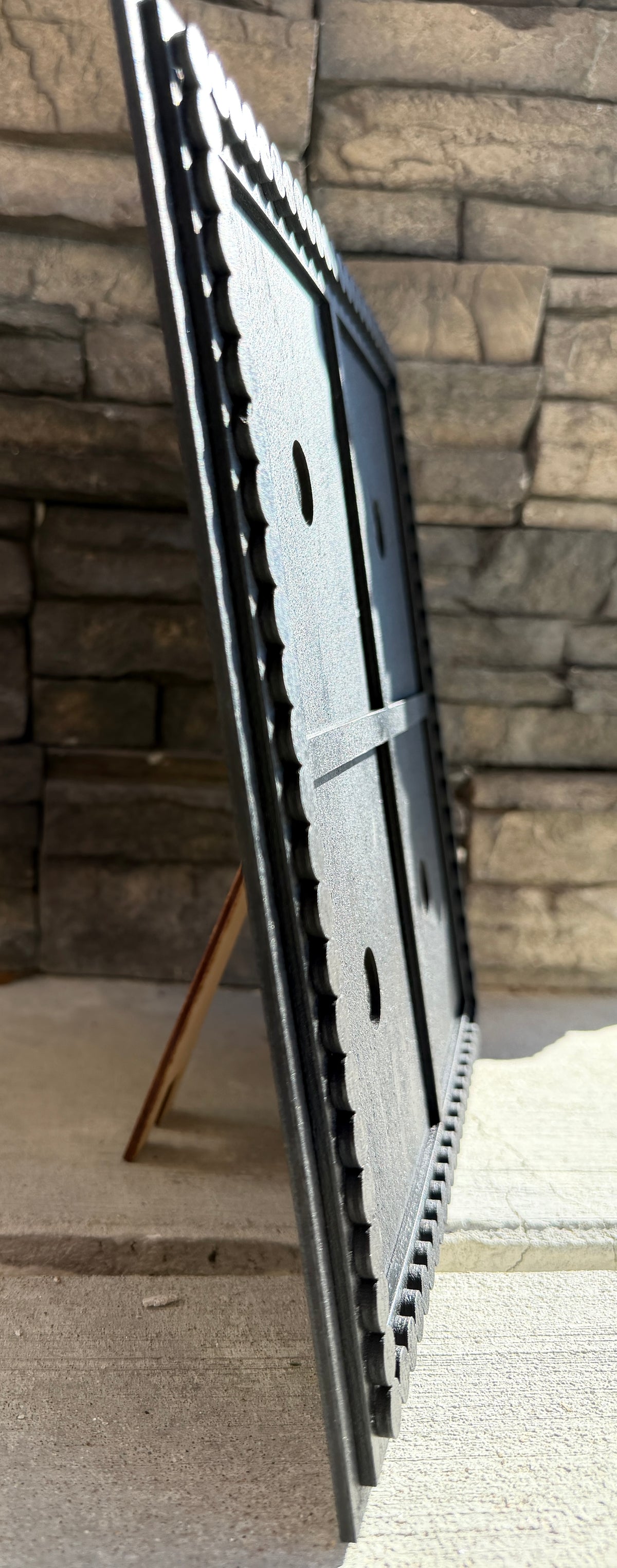a black frame on a stand