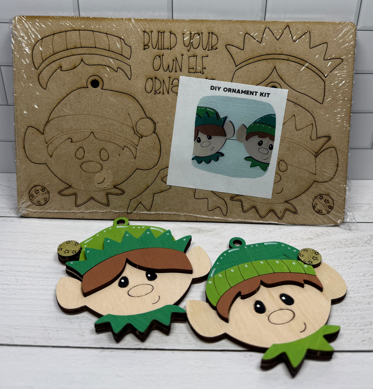 a couple of wooden ornaments on a white surface