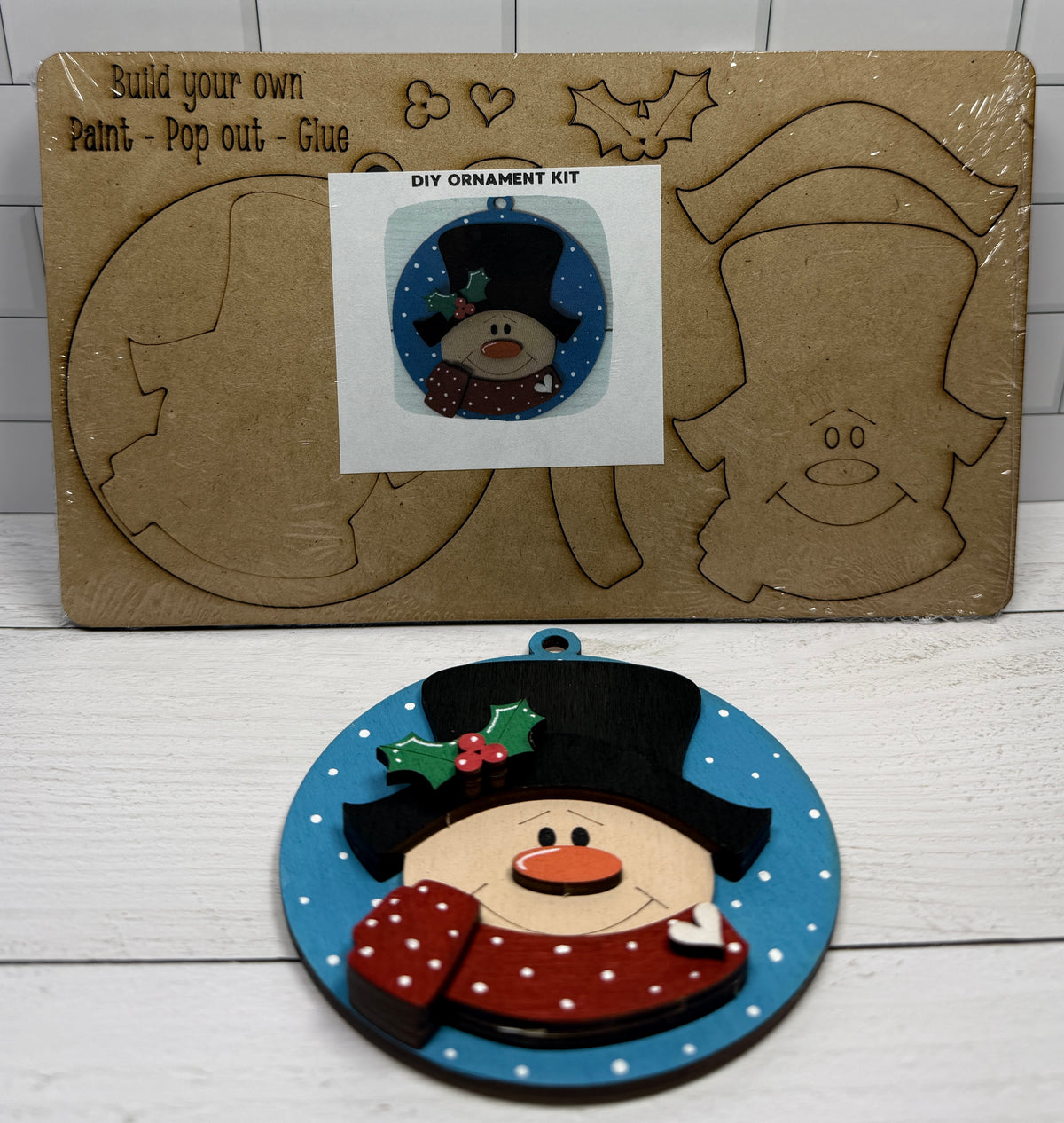 a snowman ornament and a diy kit