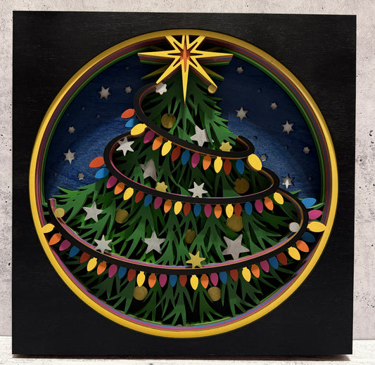 a paper cut out of a christmas tree
