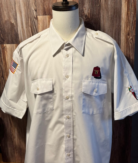 a white shirt with a flag patch on it