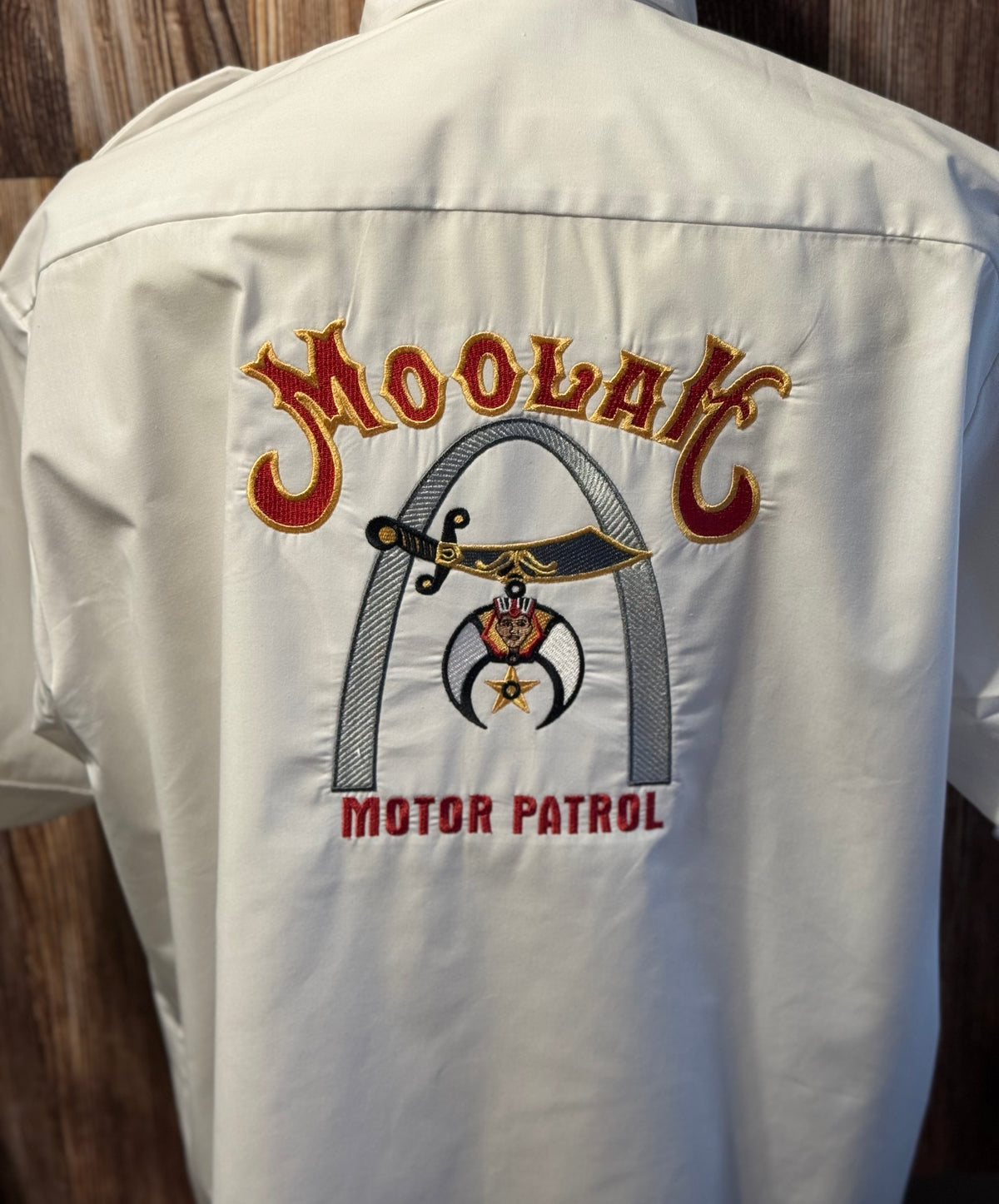 a white shirt with a logo on it