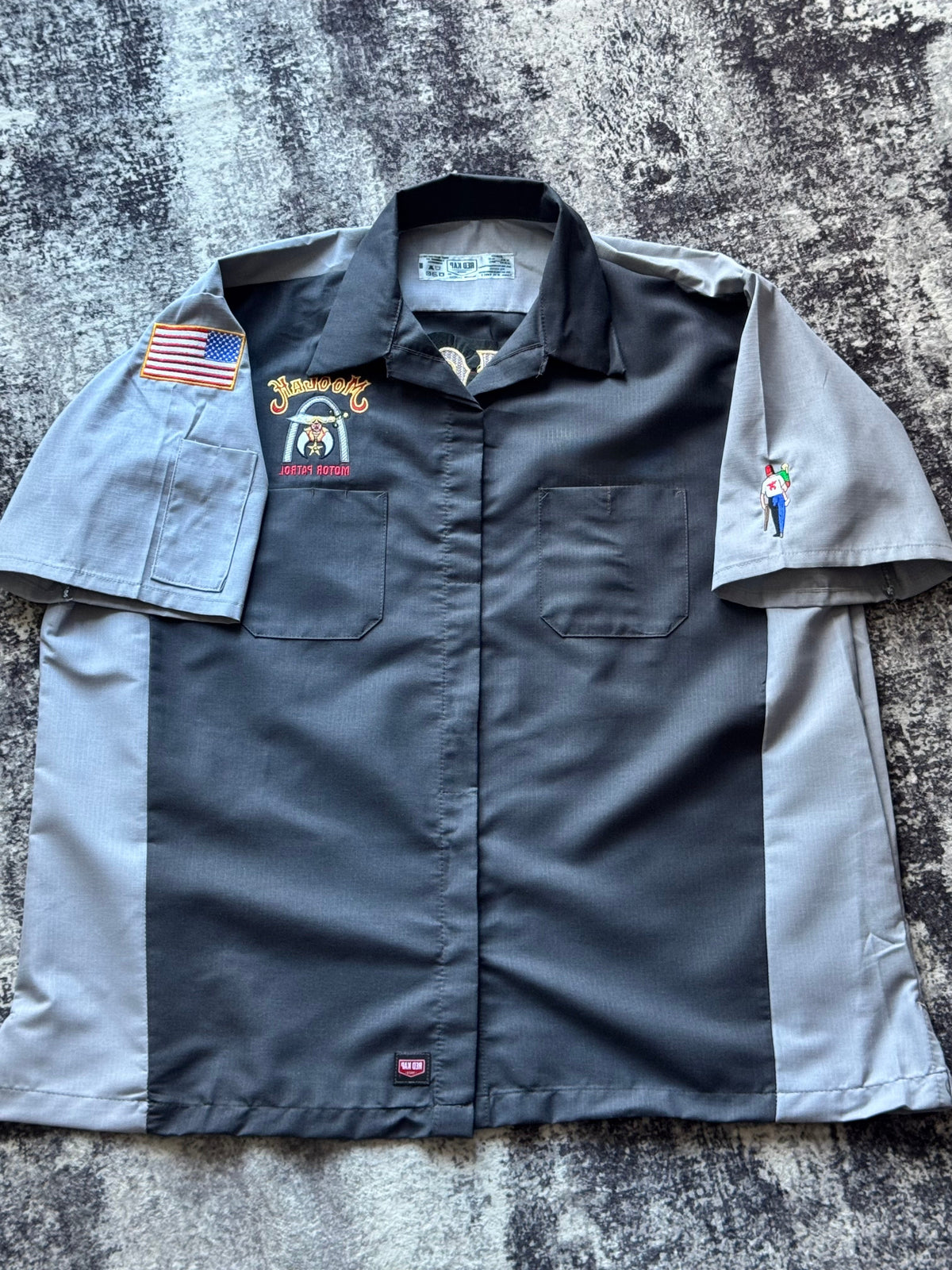 Short-sleeve shirts with embroidered designs on a textured surface