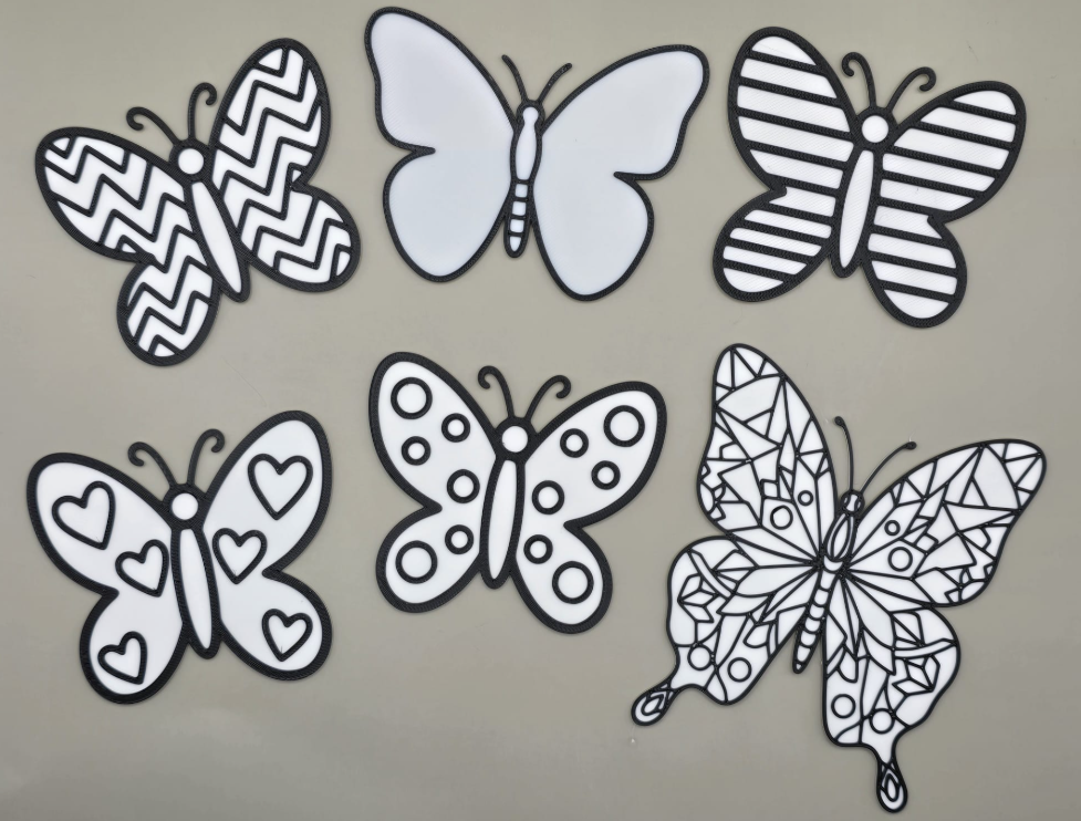 a group of butterflies on a gray surface