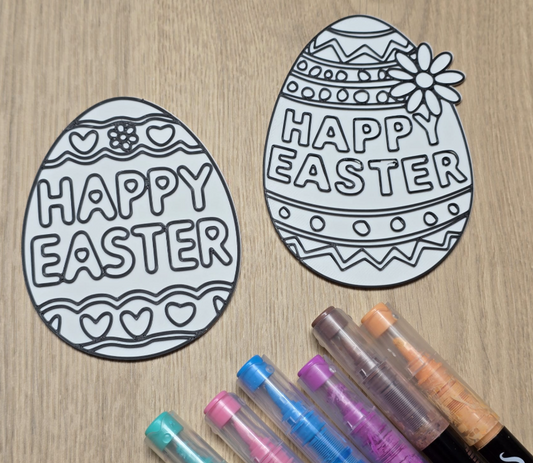 a group of markers next to a couple of eggs