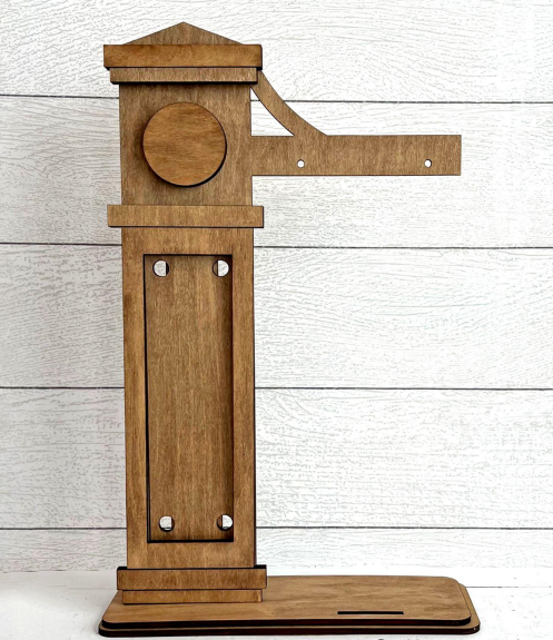 Wooden model of a historical device on a light wooden background
